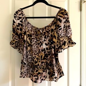 Animal print peplum short sleeve shirt